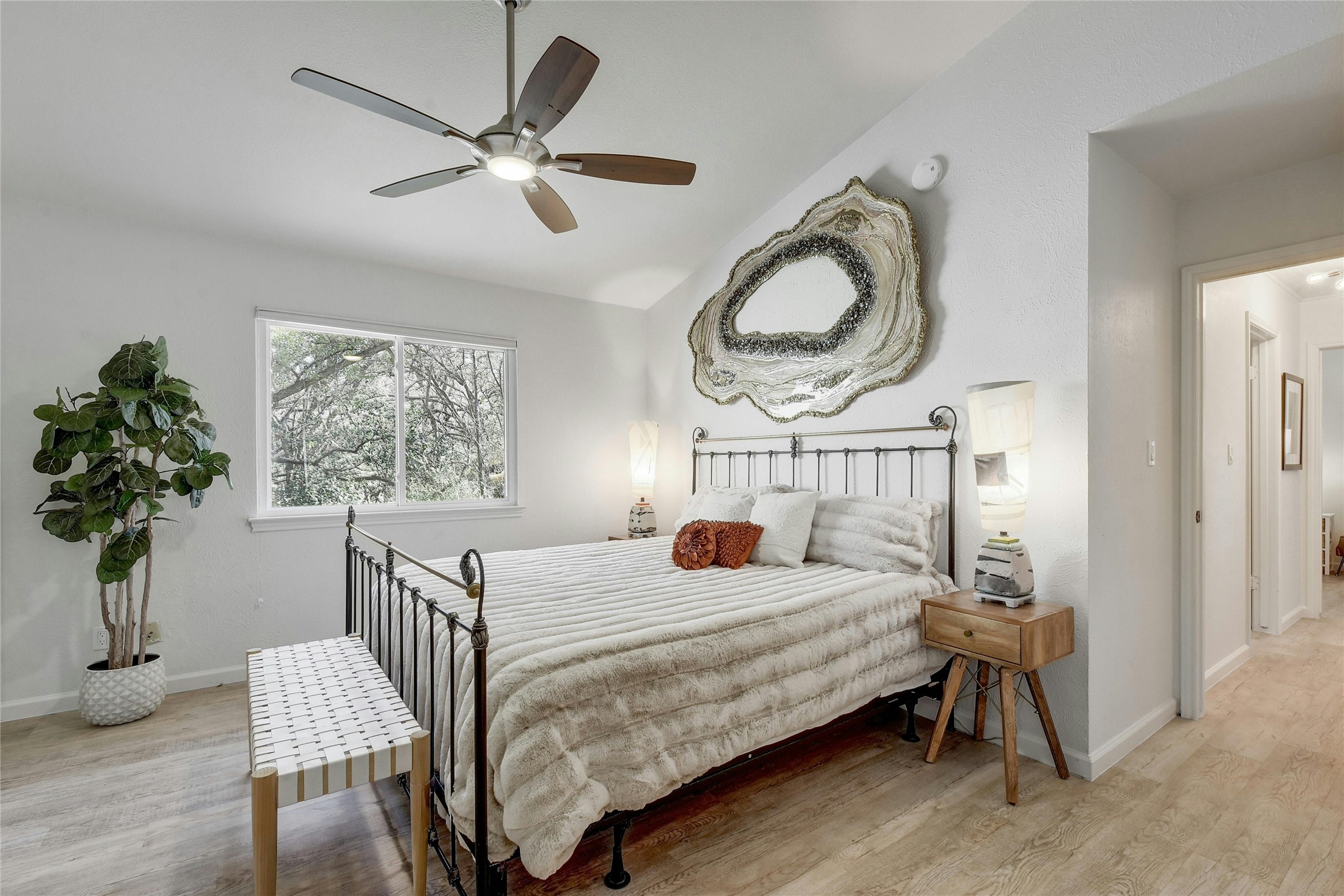 1503 Terrapin Court, Unit B Austin, TX 78746 - Photo 17 of 35 Bedroom with vaulted ceiling, light wood-style floors, and ceiling fan
