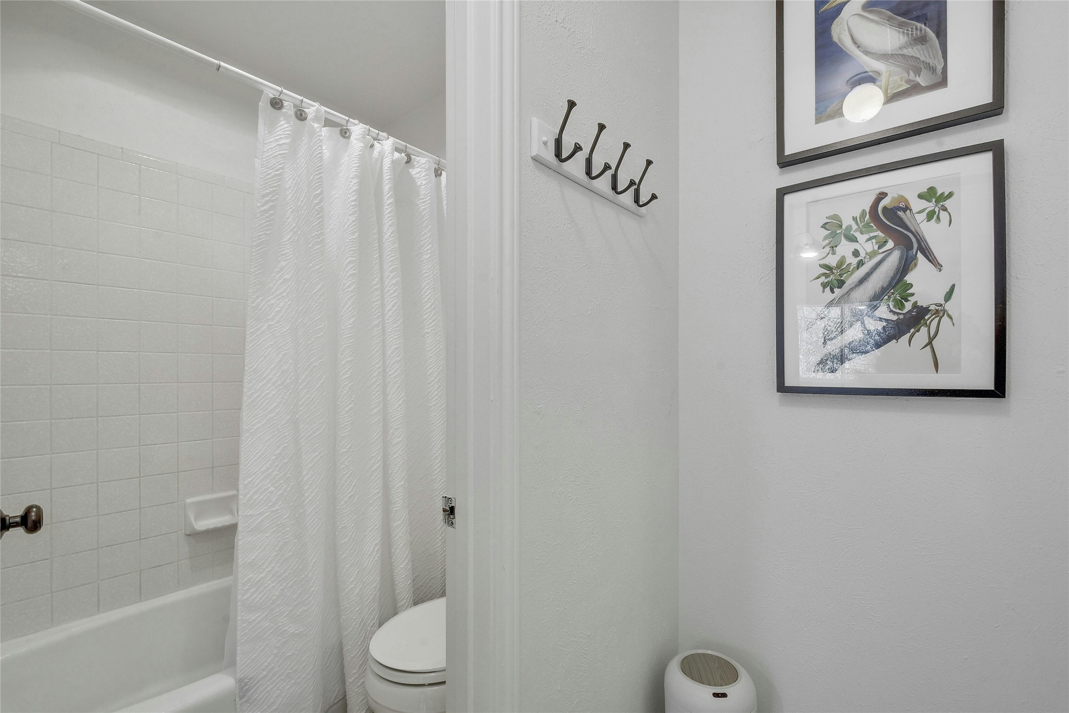 1503 Terrapin Court, Unit B Austin, TX 78746 - Photo 19 of 35 Bathroom with shower / bathtub combination with curtain and toilet