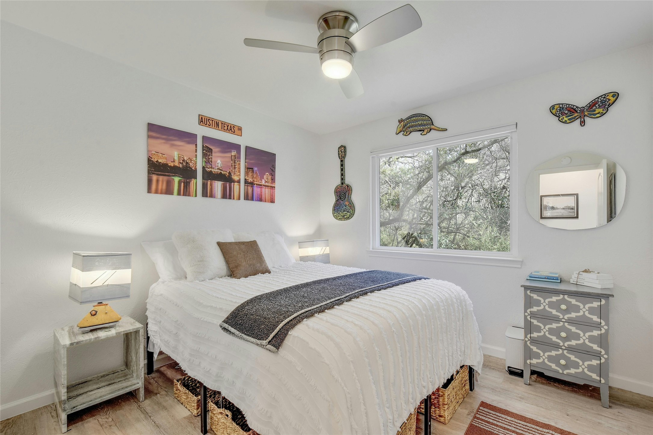 1503 Terrapin Court, Unit B Austin, TX 78746 - Photo 20 of 35 Bedroom featuring light wood-style flooring and ceiling fan