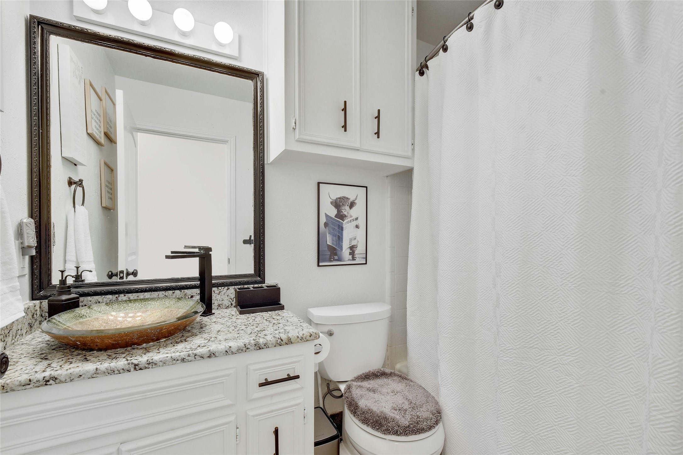 1503 Terrapin Court, Unit B Austin, TX 78746 - Photo 22 of 35 Bathroom with vanity and curtained shower