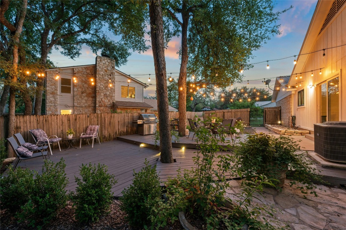 1503 Terrapin Court, Unit B Austin, TX 78746 - Photo 26 of 28 a view of a patio with table and chairs and potted plants