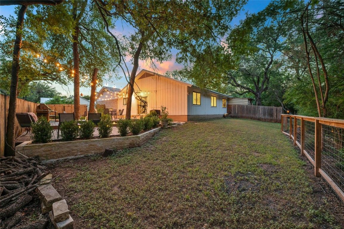 1503 Terrapin Court, Unit B Austin, TX 78746 - Photo 27 of 28 a view of a house with a yard