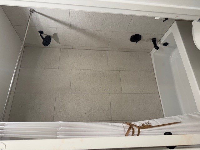 1503 Terrapin Court, Unit B Austin, TX 78746 - Photo 30 of 35 Bathroom with shower / bathtub combination with curtain and toilet