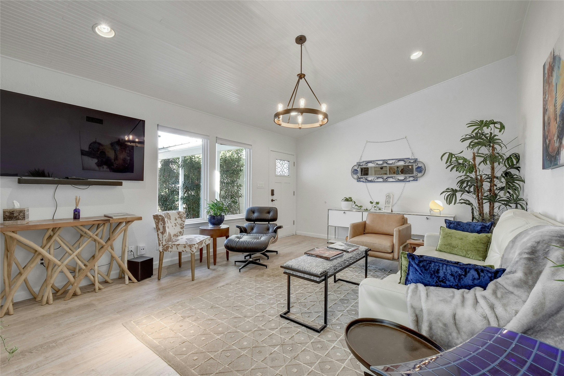 1503 Terrapin Court, Unit B Austin, TX 78746 - Photo 5 of 35 Living area featuring wood finished floors, recessed lighting, and a chandelier