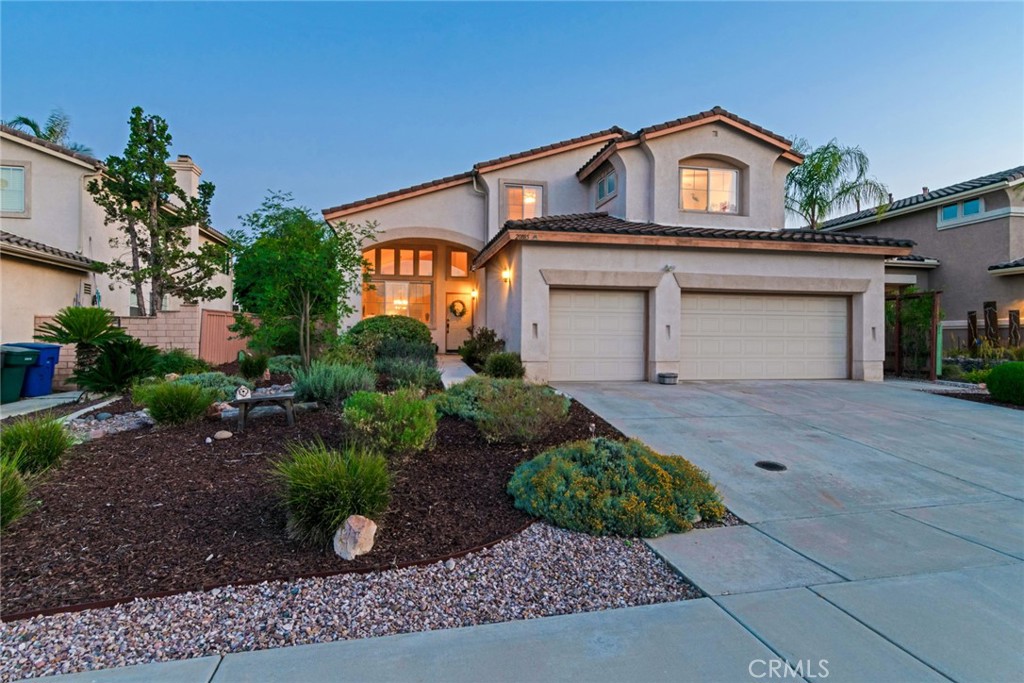 20885 Bakal Drive Riverside, CA 92508 - Photo 1 of 47 a front view of a house with a garden
