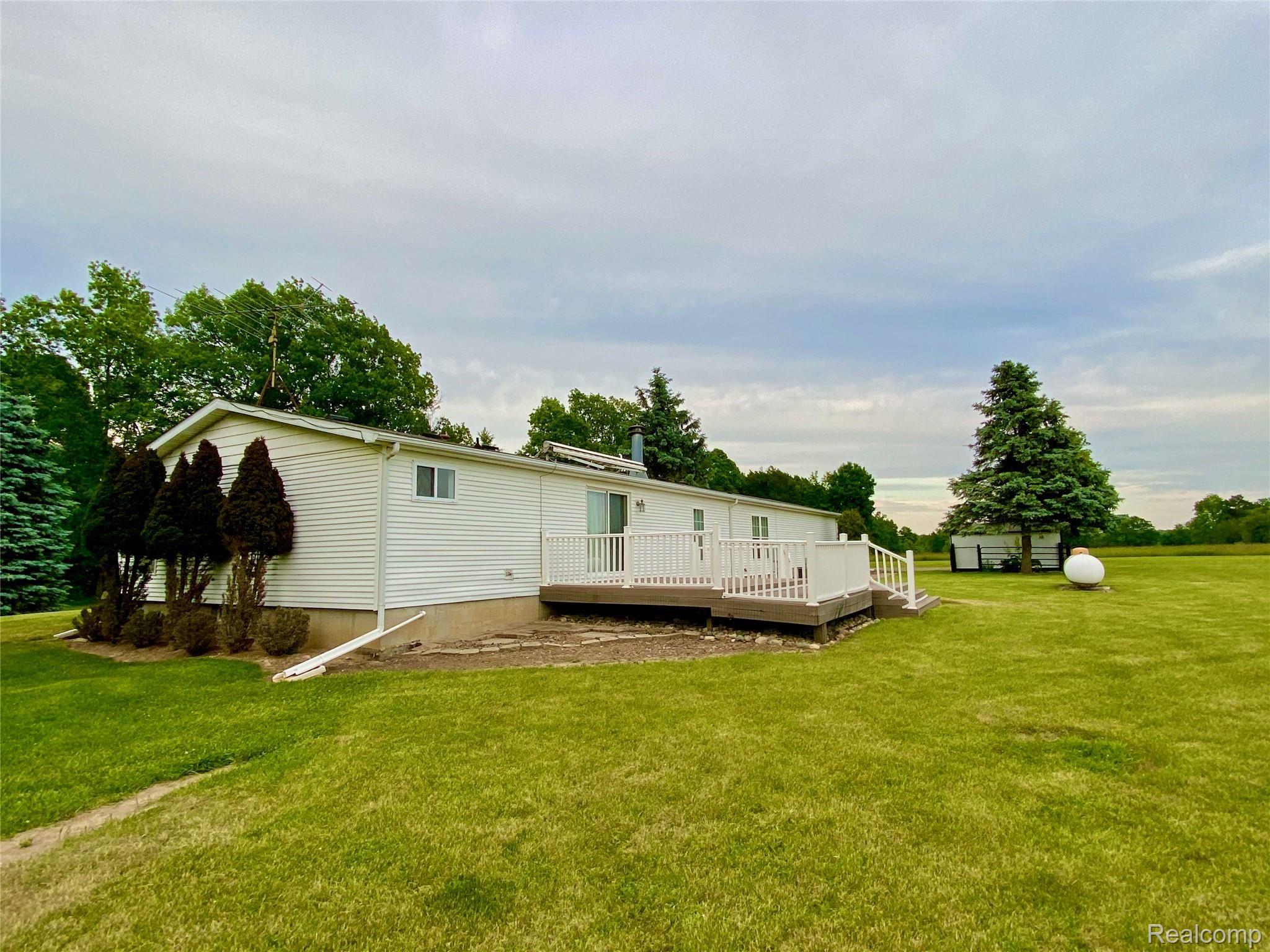 2914 East Hunters Creek Road Metamora, MI 48455 - Photo 5 of 33 Rear View of Ranch Home