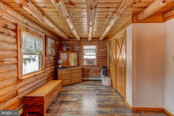 a view of a livingroom with furniture and a flat screen tv