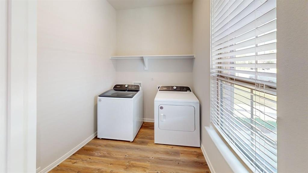 1840 Rosedale Avenue Van Alstyne, TX 75495 - Photo 21 of 24 Dedicated laundry area featuring wood-finish flooring and a window with blinds