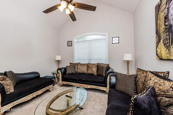 a living room with furniture and a couch