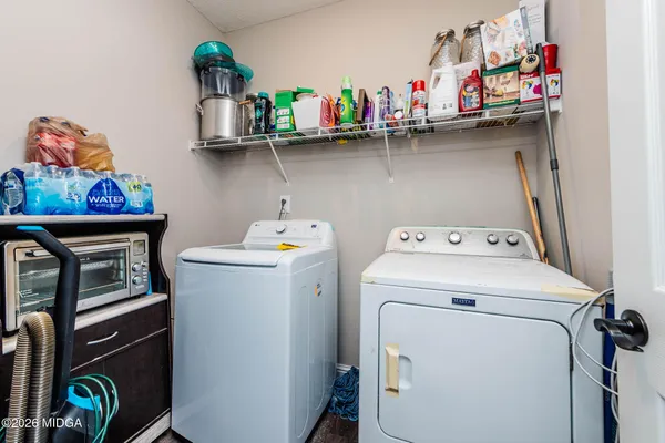 a utility room with dryer and washer
