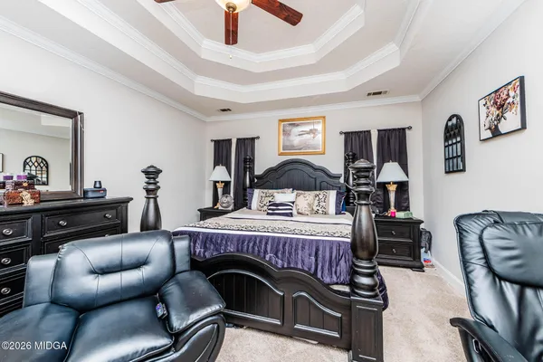 a bedroom with furniture and a bed