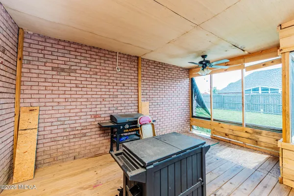 a view of a balcony with table and chairs