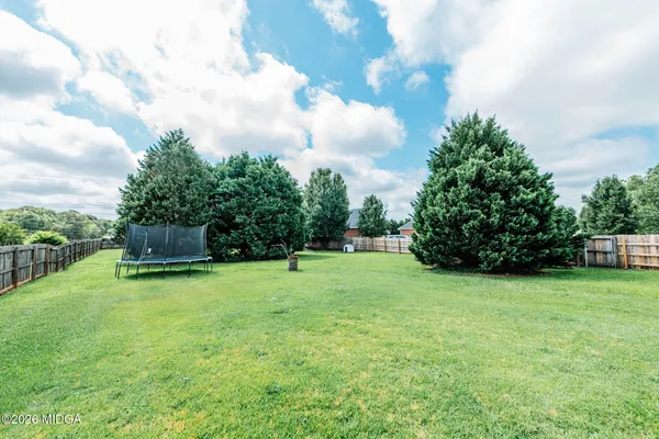 a view of a backyard with slide