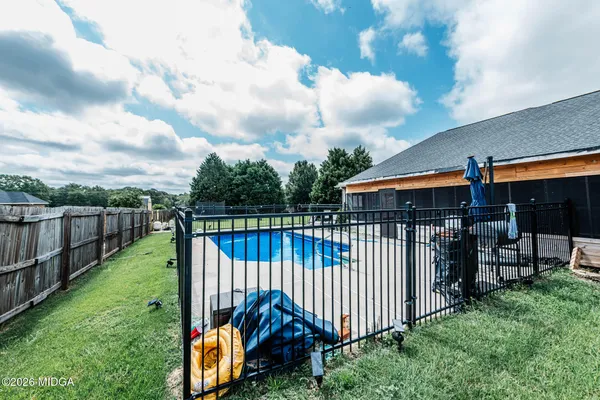 a view of a wrought iron fences in front of a house