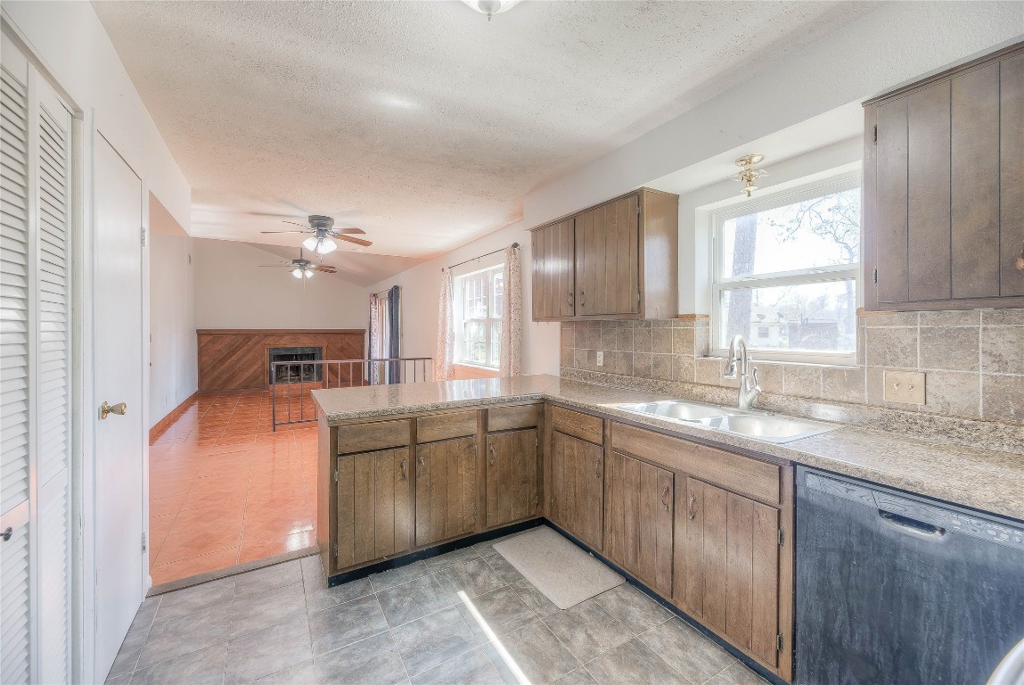 25634 Chestnut Lane Splendora, TX 77372 - Photo 11 of 45 a kitchen with cabinets and window