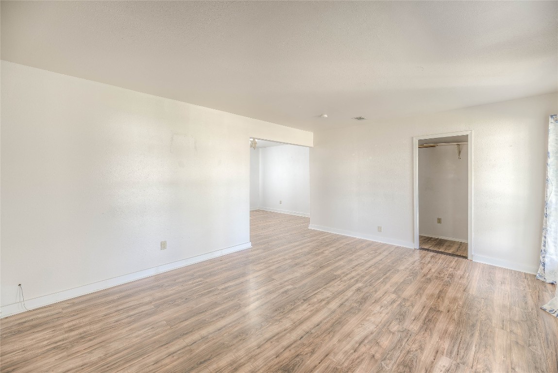 25634 Chestnut Lane Splendora, TX 77372 - Photo 15 of 45 a view of an empty room with wooden floor