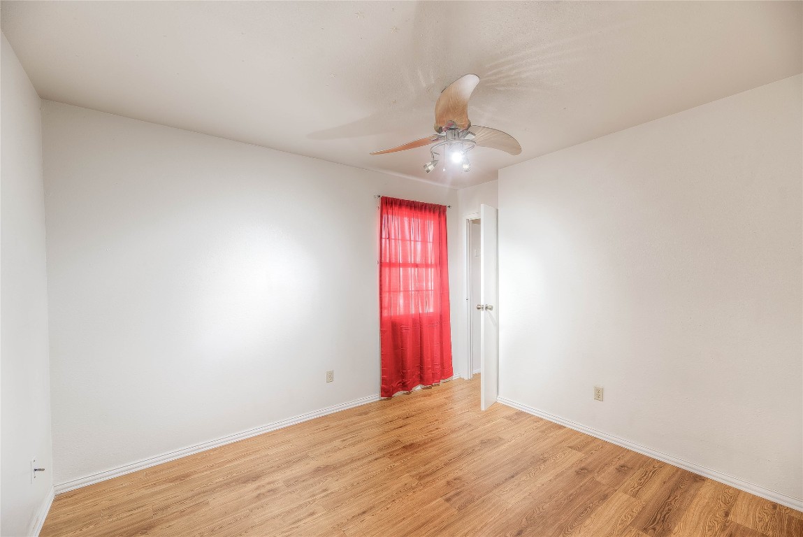 25634 Chestnut Lane Splendora, TX 77372 - Photo 19 of 45 an empty room with windows and fan