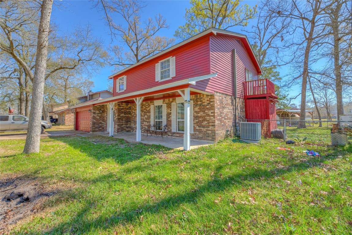 25634 Chestnut Lane Splendora, TX 77372 - Photo 27 of 45 a view of a house with a yard
