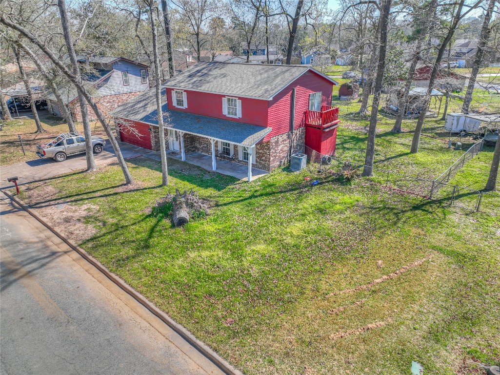 25634 Chestnut Lane Splendora, TX 77372 - Photo 36 of 45 a view of swimming pool with a yard and potted plants