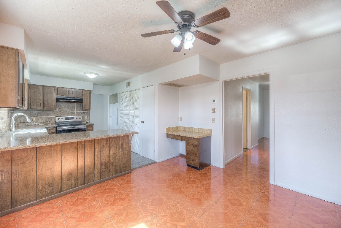 25634 Chestnut Lane Splendora, TX 77372 - Photo 8 of 45 a view of kitchen with sink and refrigerator