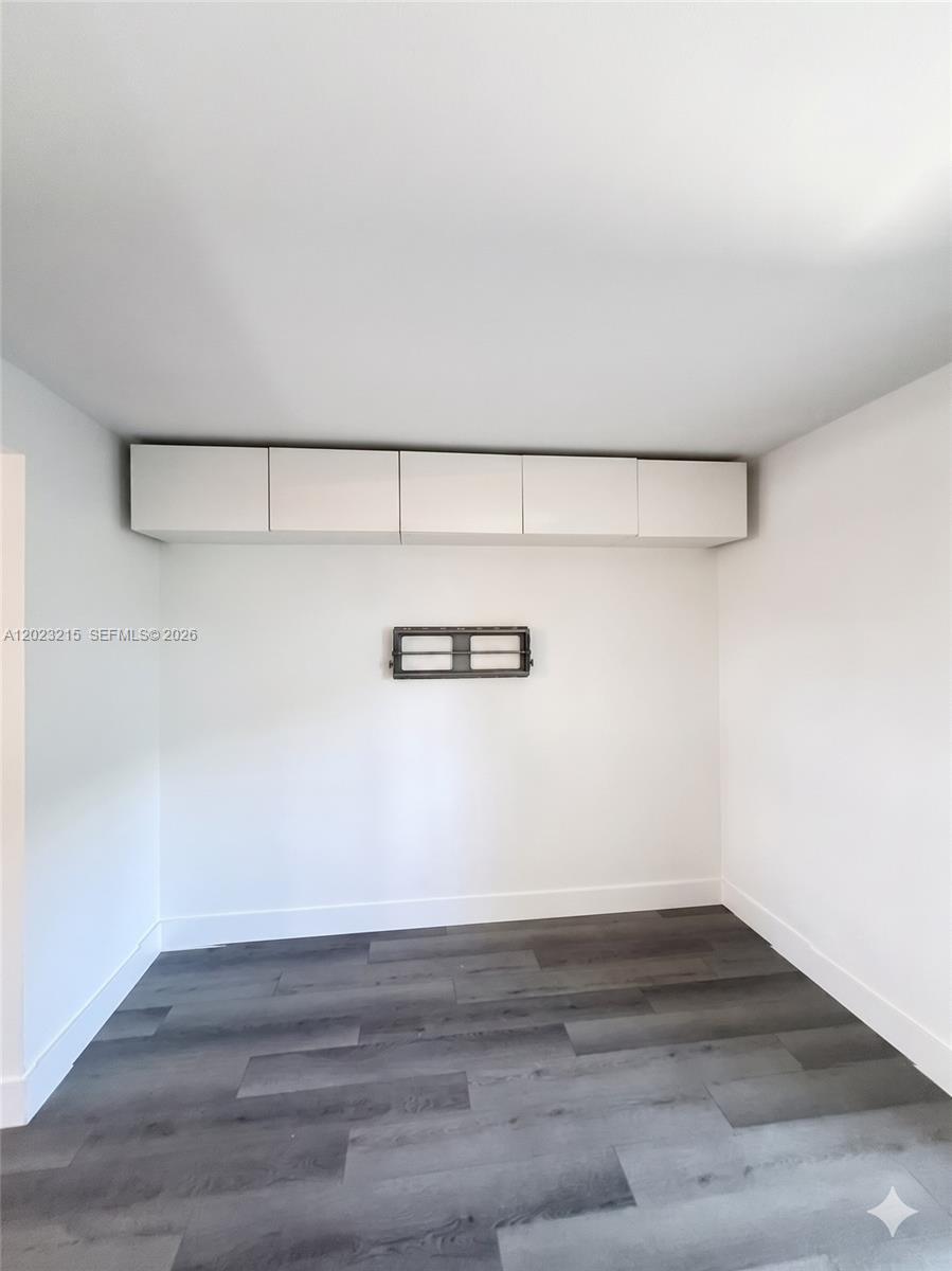 13 Southwest 3rd Street, Unit 13 Pompano Beach, FL 33060 - Photo 10 of 44 a view of a room with empty racks