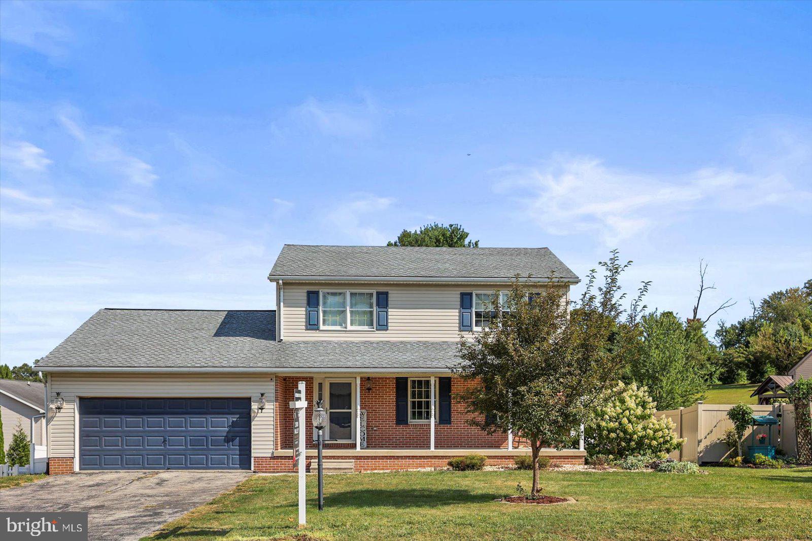113 Timber Lane Hanover, PA 17331 - Photo 1 of 43 a front view of a house with a garden
