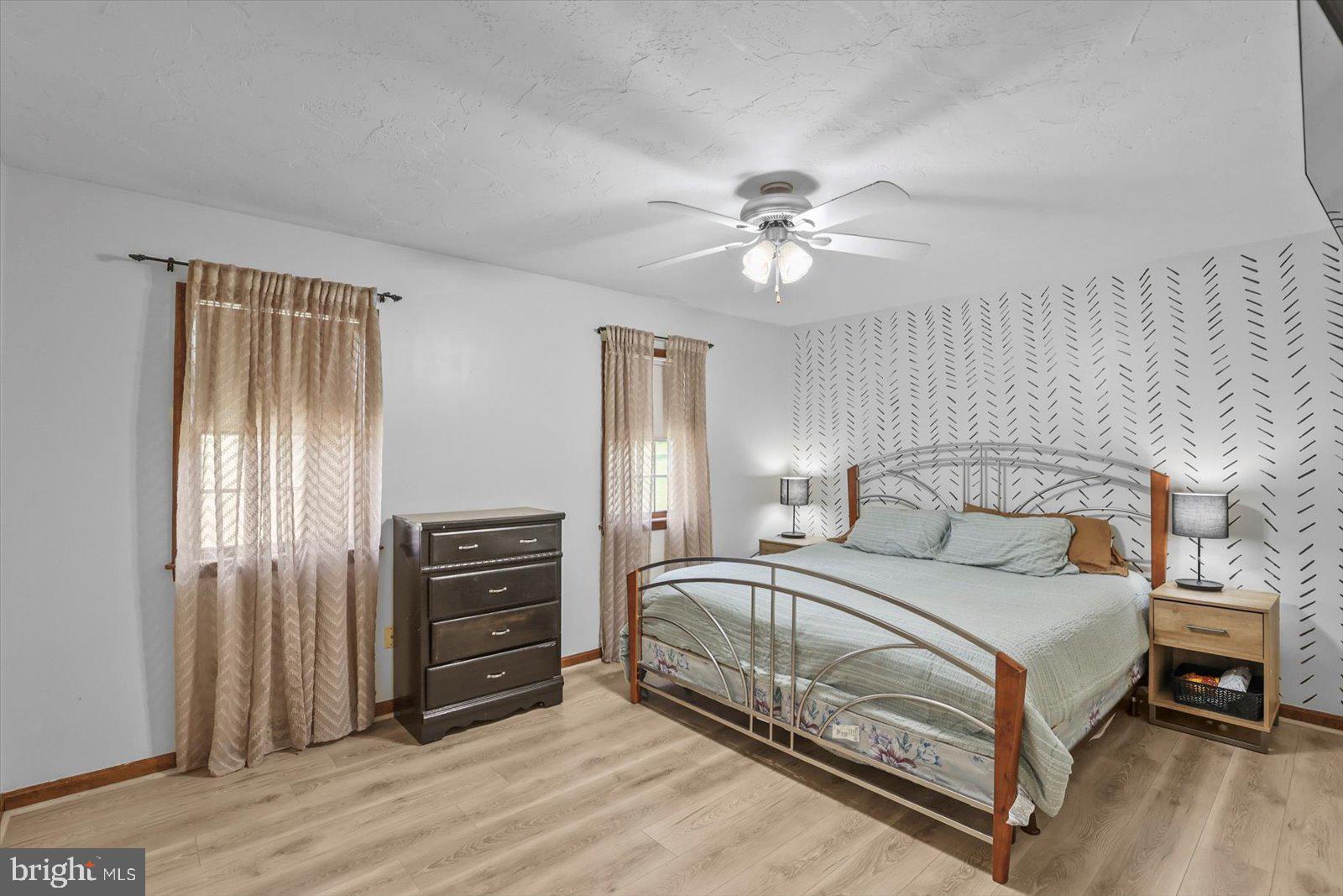 113 Timber Lane Hanover, PA 17331 - Photo 23 of 43 a bedroom with a bed and a chandelier