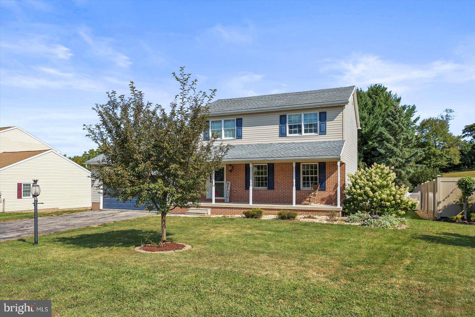 113 Timber Lane Hanover, PA 17331 - Photo 3 of 43 a front view of a house with garden