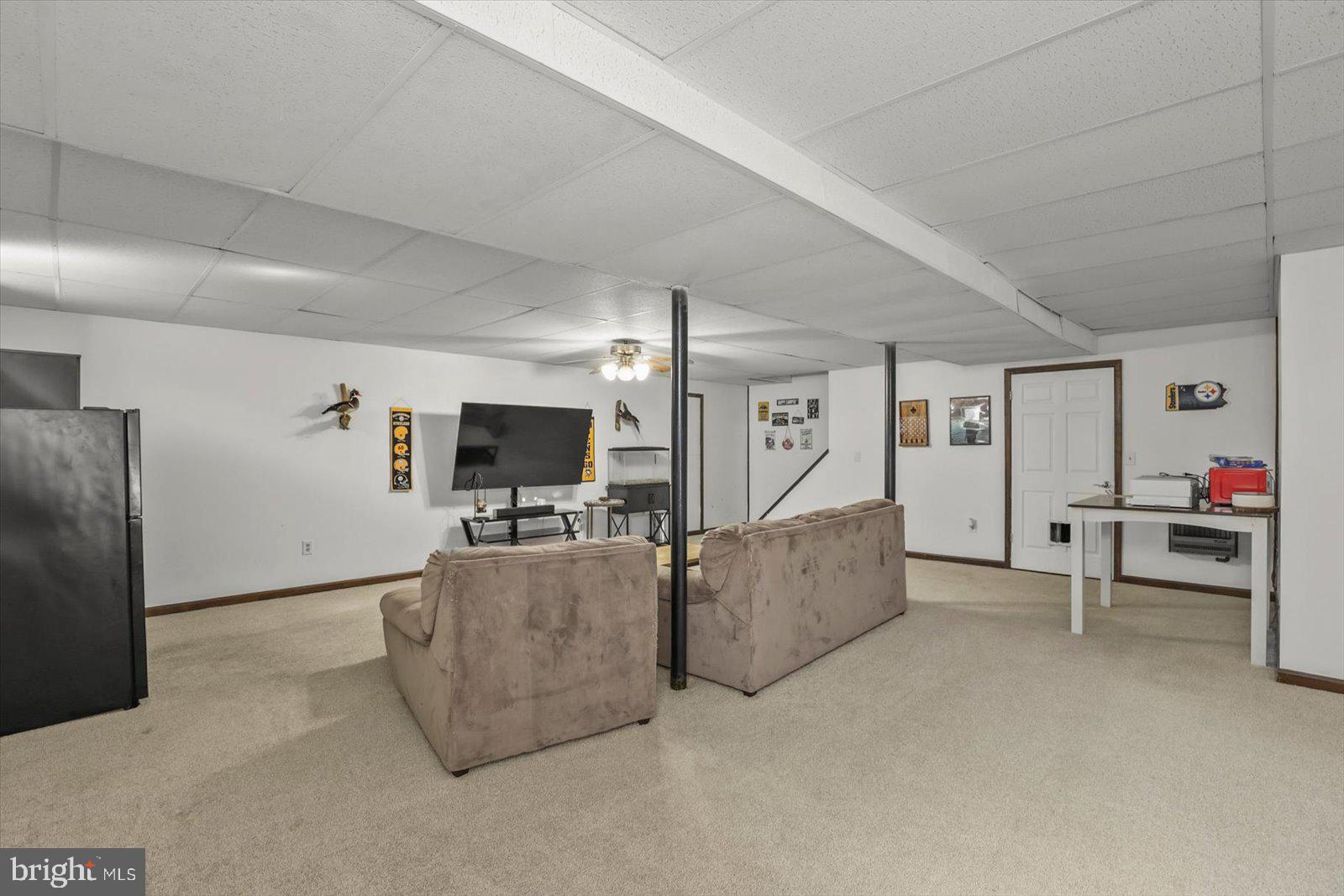 113 Timber Lane Hanover, PA 17331 - Photo 32 of 43 a living room with furniture and a flat screen tv