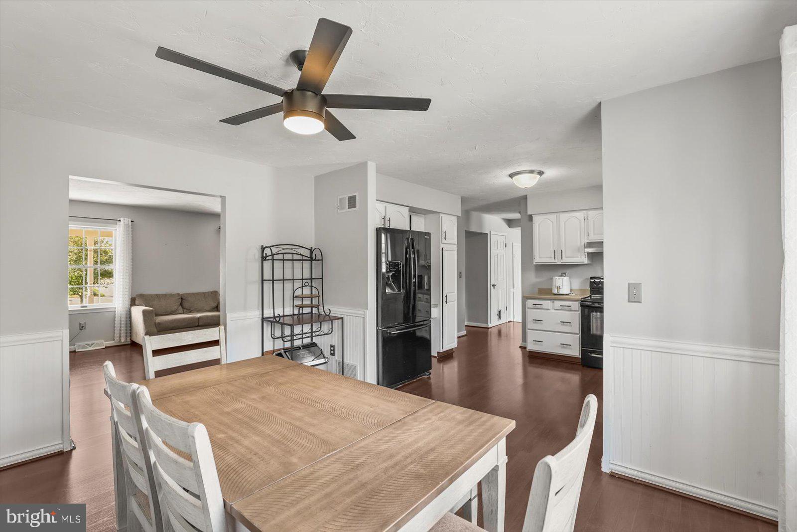 113 Timber Lane Hanover, PA 17331 - Photo 6 of 43 a kitchen with a table chairs refrigerator and cabinets