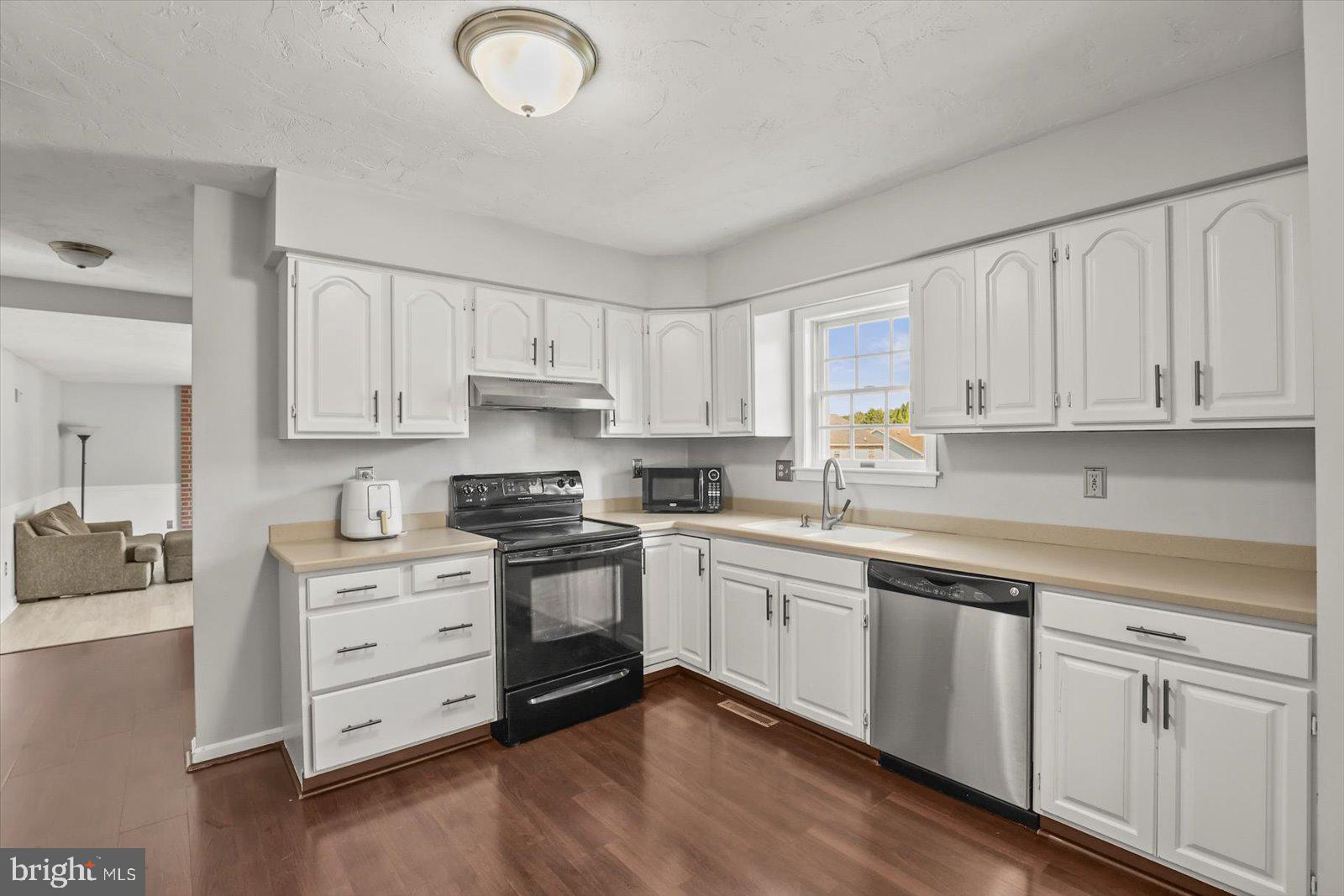 113 Timber Lane Hanover, PA 17331 - Photo 8 of 43 a kitchen with cabinets stainless steel appliances and a window