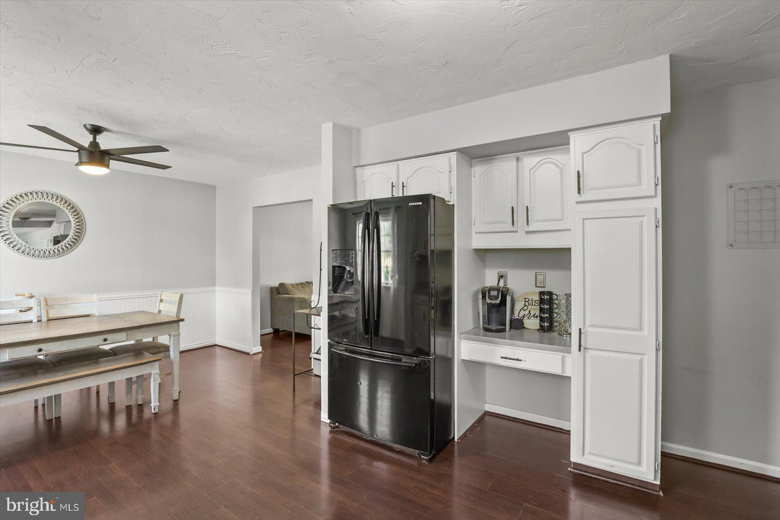 113 Timber Lane Hanover, PA 17331 - Photo 10 of 43 a kitchen with stainless steel appliances a refrigerator a stove a sink and dishwasher with wooden floor