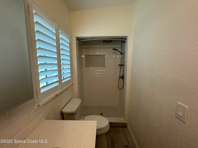 a bathroom with a sink and toilet