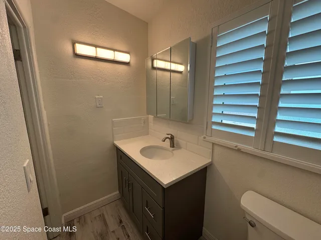 a bathroom with a sink and a toilet
