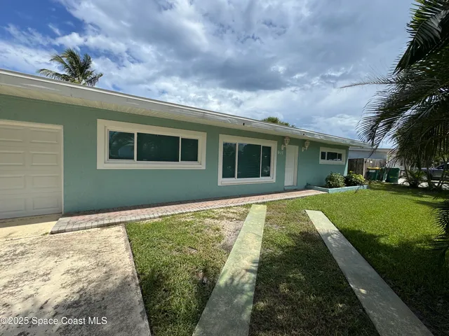 a house view with a garden space