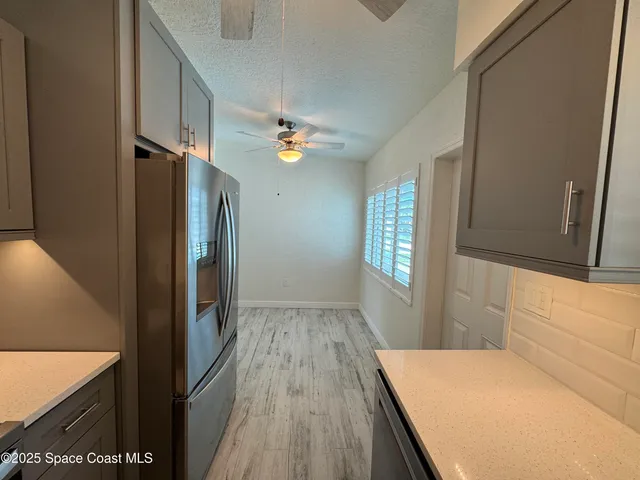 a view of hallway with wooden floor
