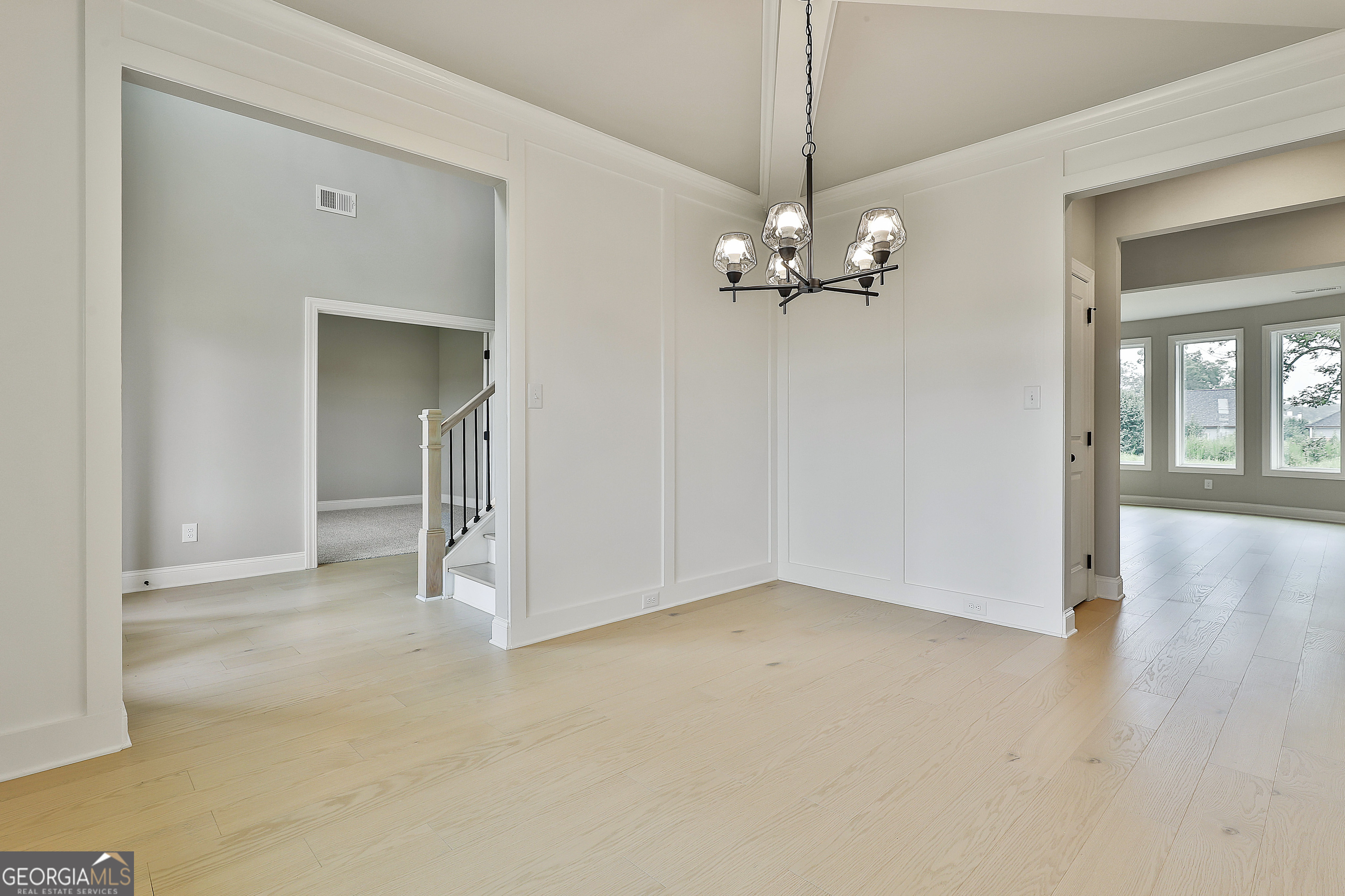 291 Grove Park, Unit 90 Senoia, GA 30276 - Photo 14 of 53 an empty room with chandelier fan and windows