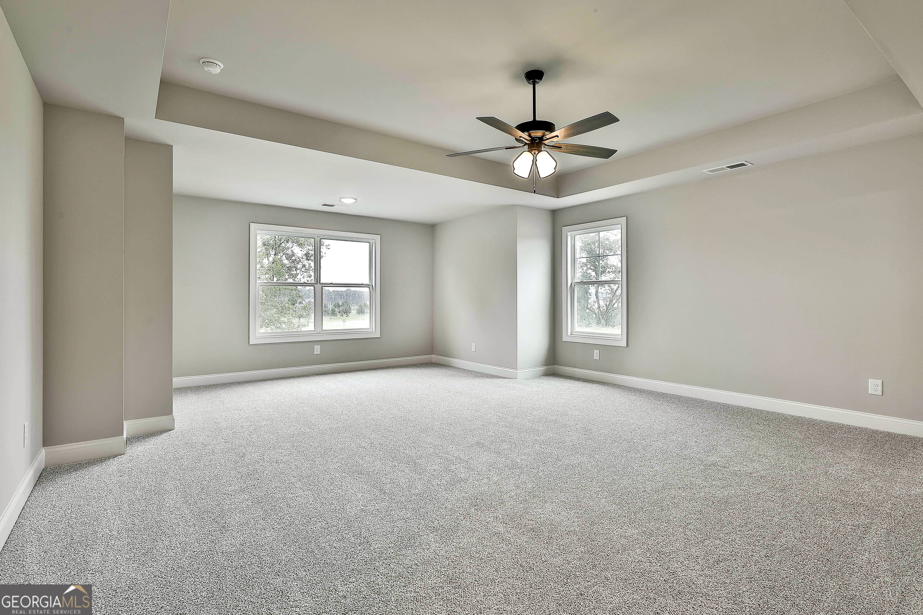 291 Grove Park, Unit 90 Senoia, GA 30276 - Photo 35 of 53 a view of a big room with windows and chandelier fan
