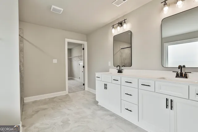 a bathroom with a shower a bathtub and a shower