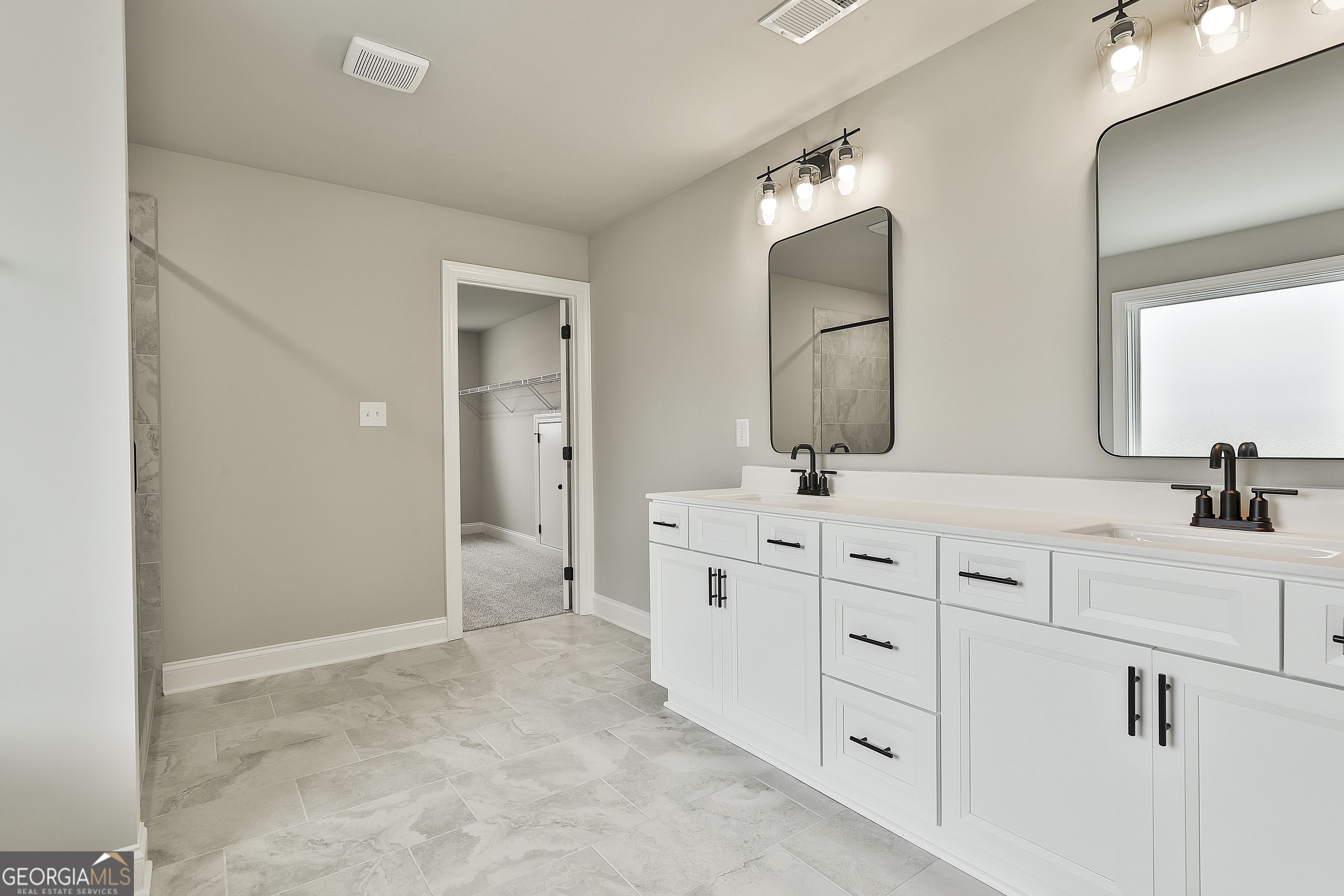 291 Grove Park, Unit 90 Senoia, GA 30276 - Photo 38 of 53 a spacious bathroom with double sink and a mirror