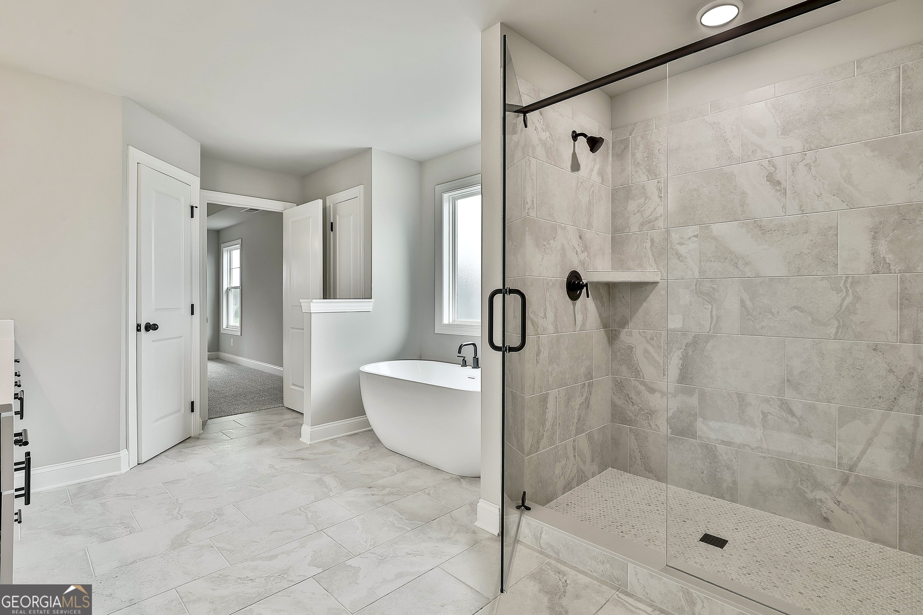 291 Grove Park, Unit 90 Senoia, GA 30276 - Photo 39 of 53 a bathroom with a shower a bathtub and a shower