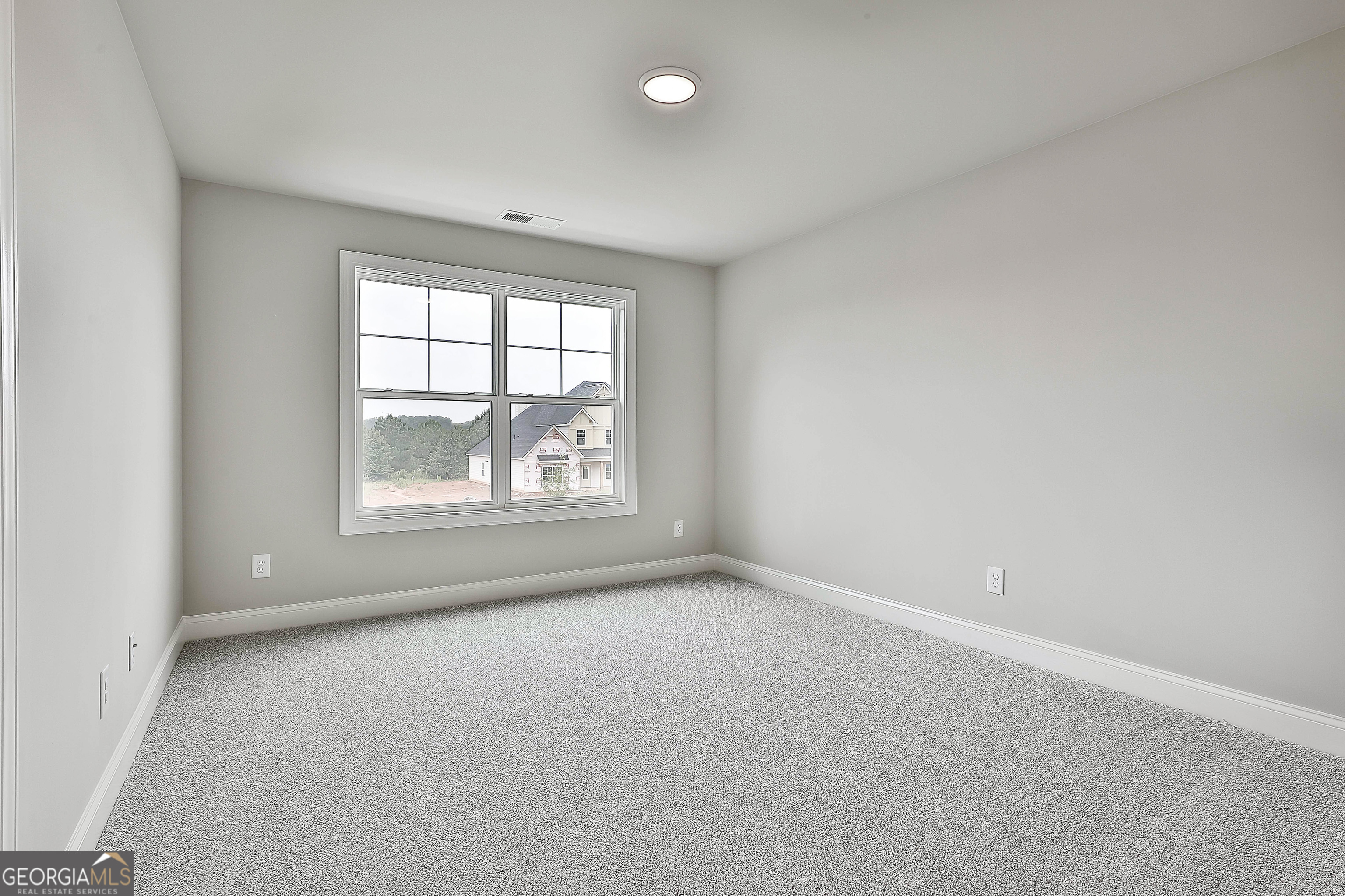 291 Grove Park, Unit 90 Senoia, GA 30276 - Photo 43 of 53 an empty room with a window