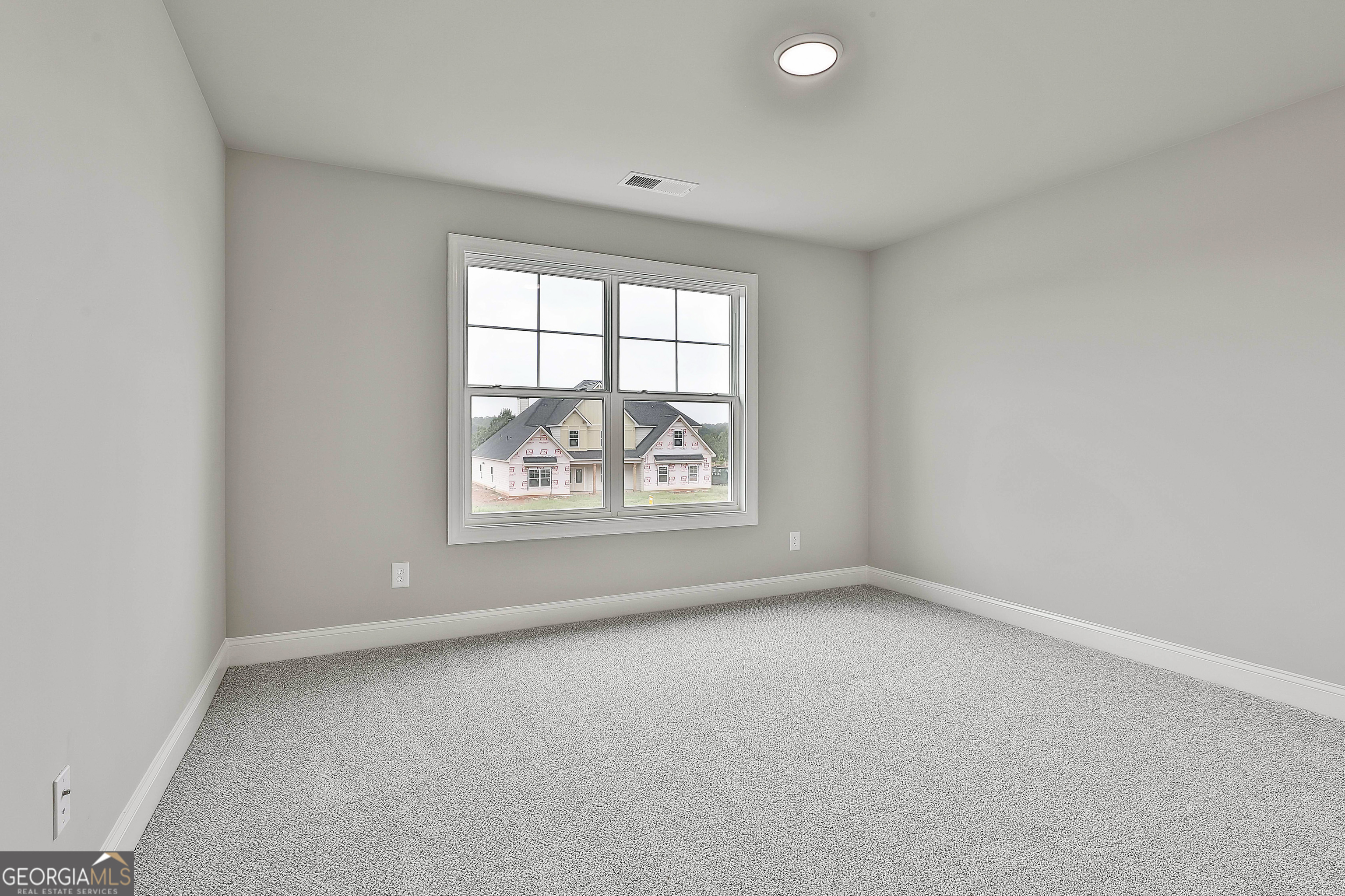 291 Grove Park, Unit 90 Senoia, GA 30276 - Photo 45 of 53 an empty room with a window