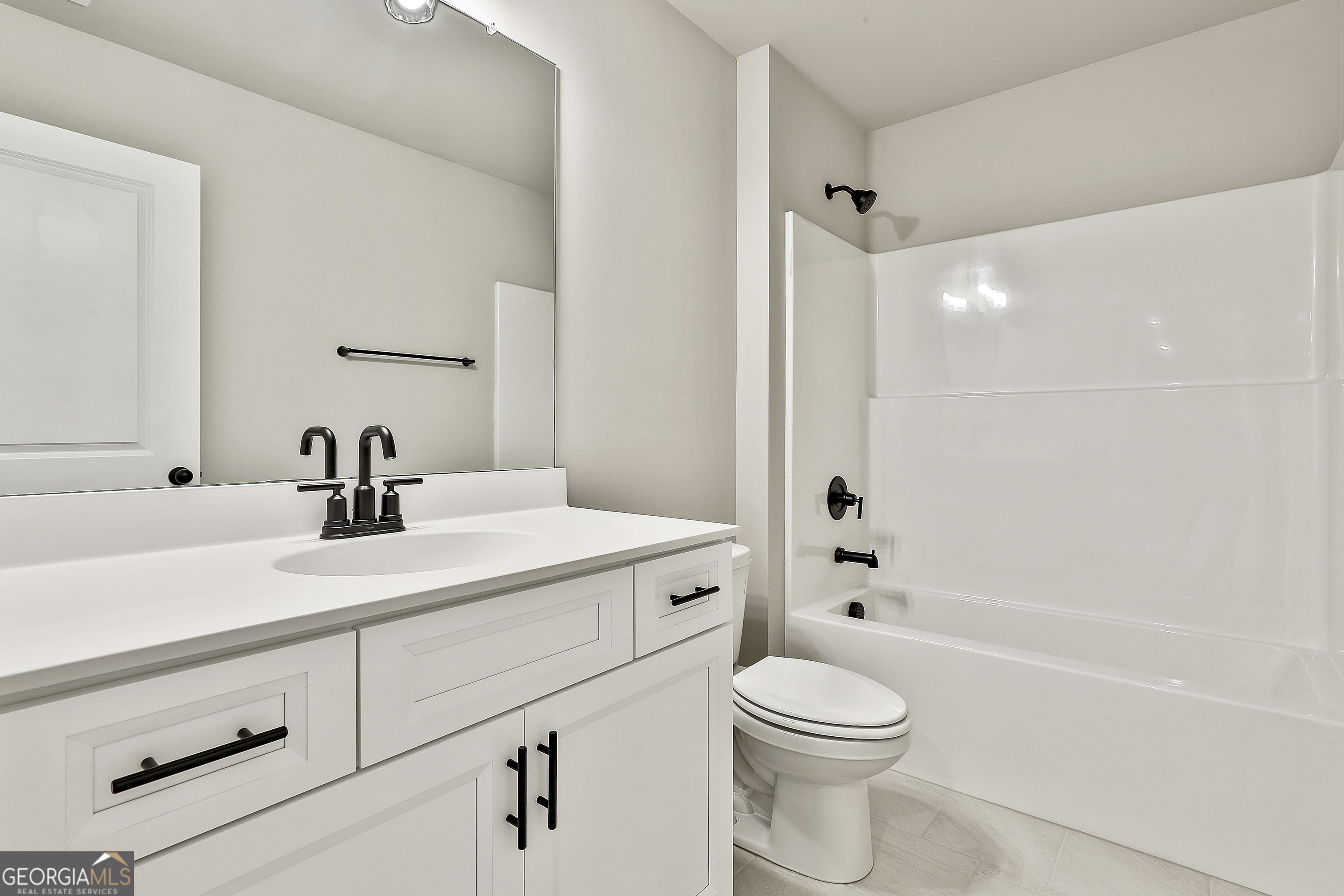 291 Grove Park, Unit 90 Senoia, GA 30276 - Photo 46 of 53 a bathroom with a sink a toilet and shower