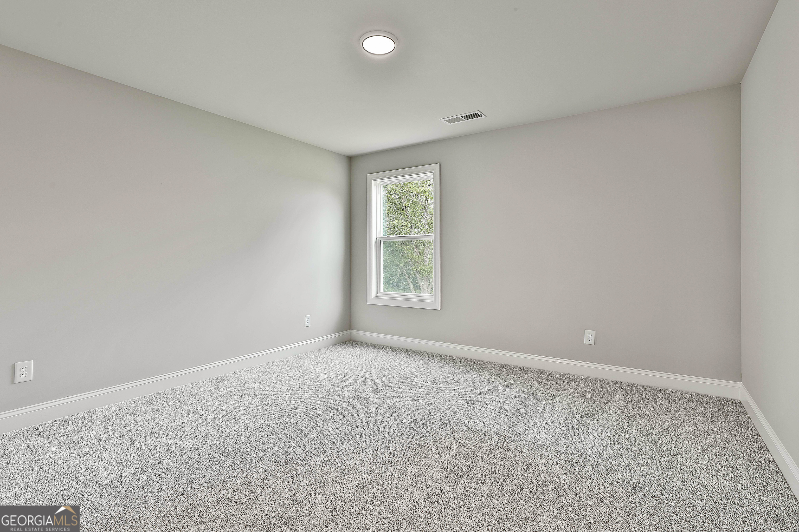 291 Grove Park, Unit 90 Senoia, GA 30276 - Photo 47 of 53 a view of an empty room with a window