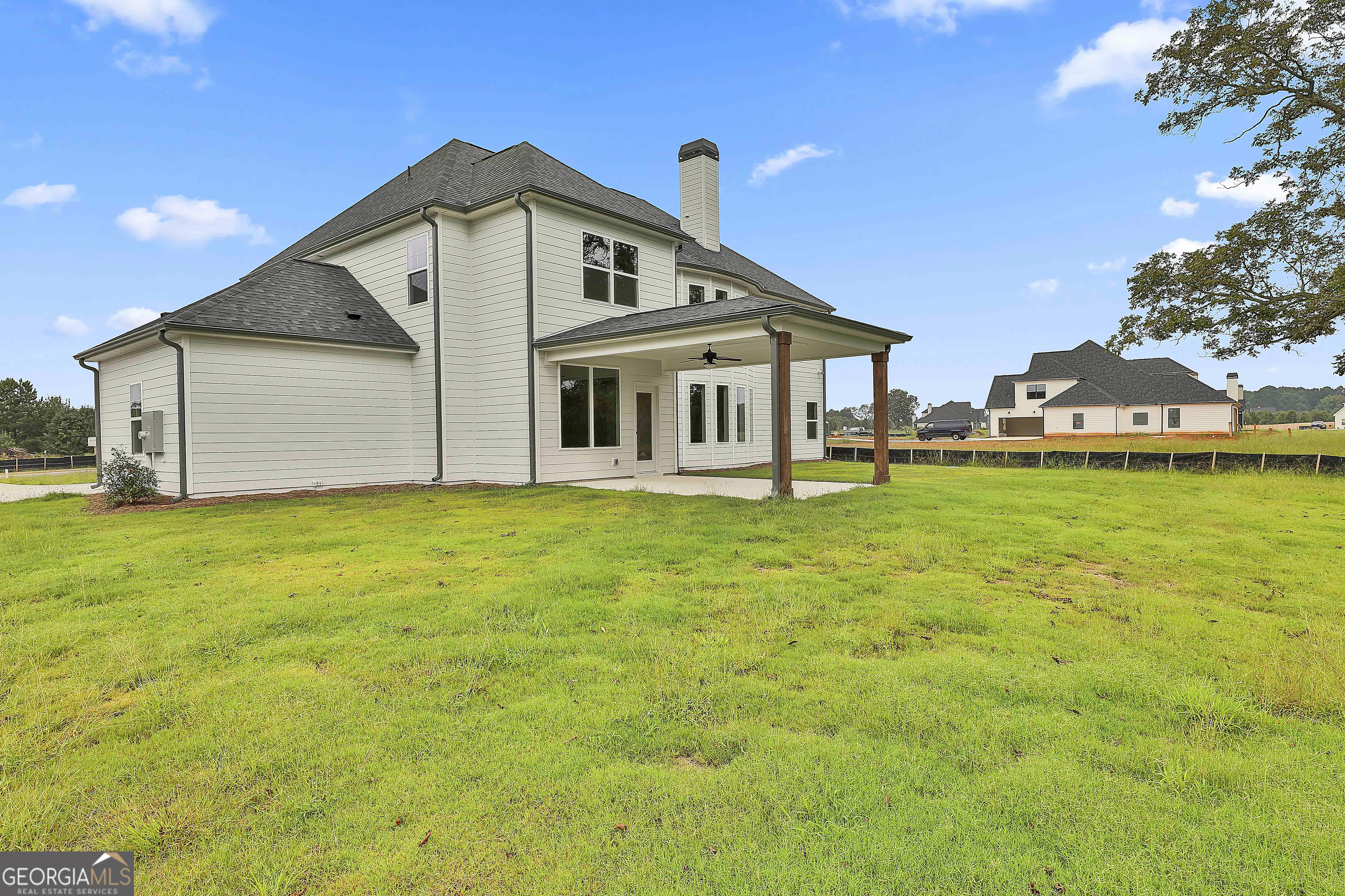 291 Grove Park, Unit 90 Senoia, GA 30276 - Photo 52 of 53 a front view of a house with garden