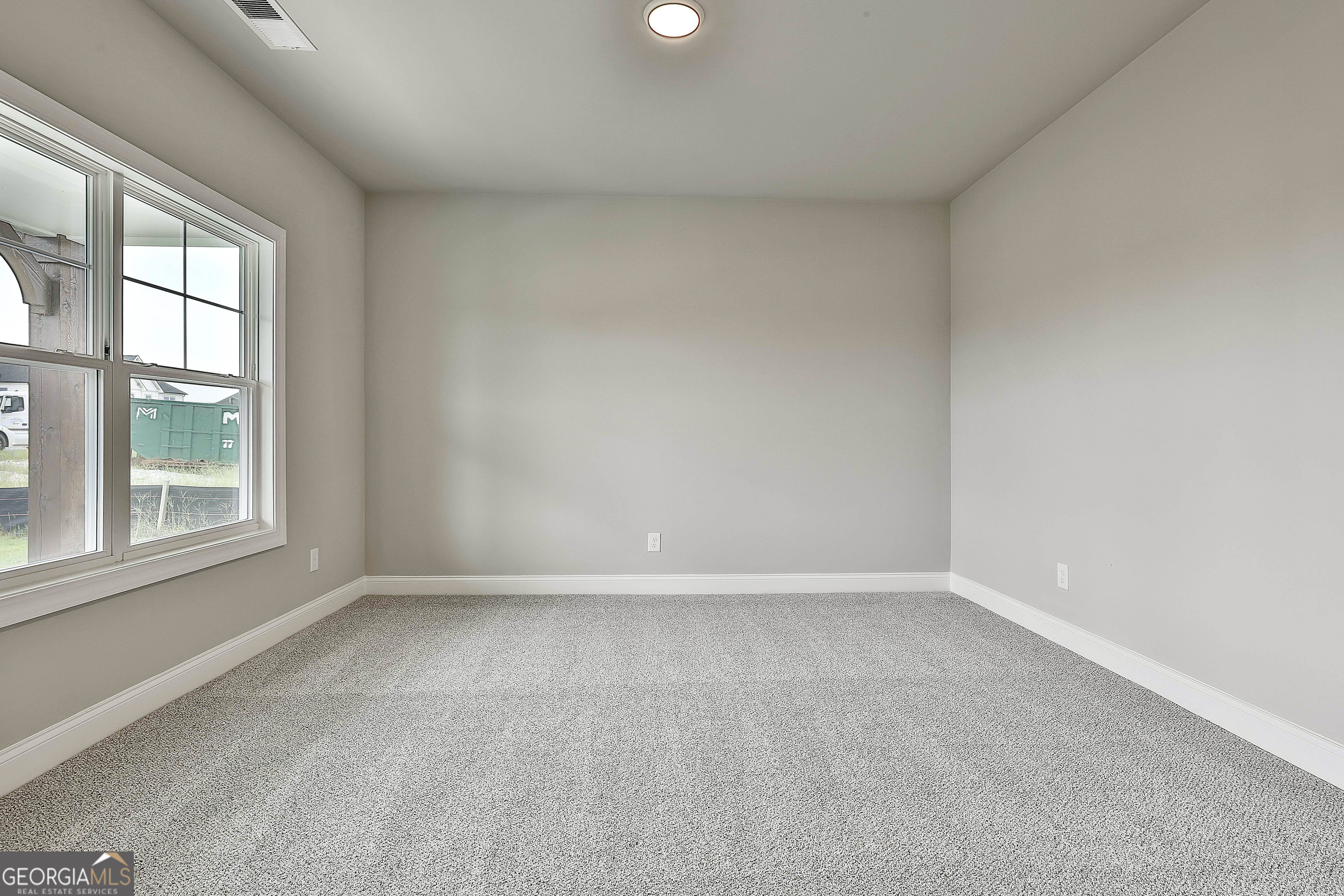 291 Grove Park, Unit 90 Senoia, GA 30276 - Photo 9 of 53 an empty room with a window