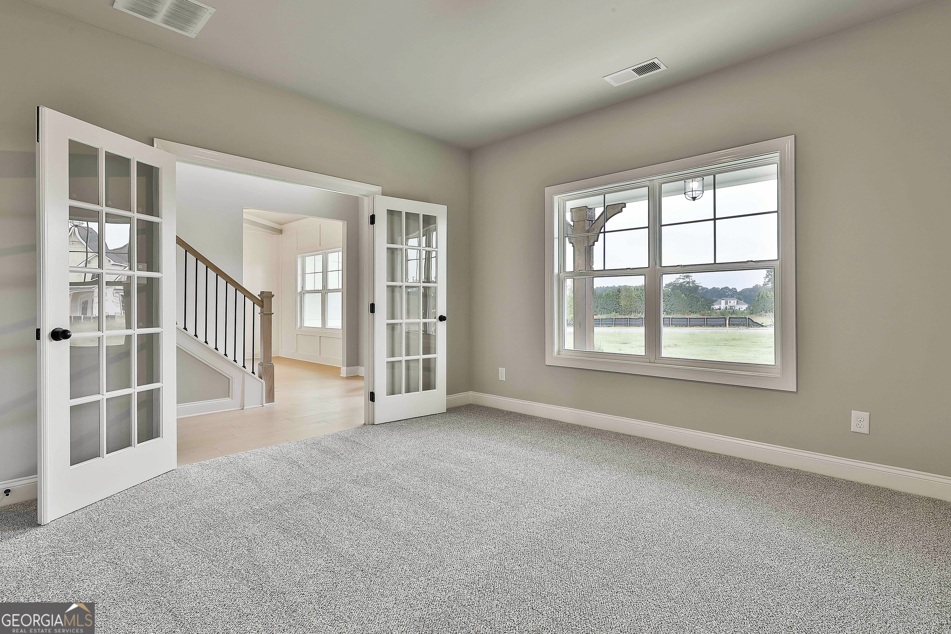 291 Grove Park, Unit 90 Senoia, GA 30276 - Photo 10 of 53 a view of an empty room with a window