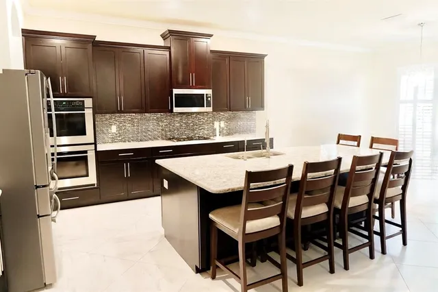 a view of a room with furniture and a window