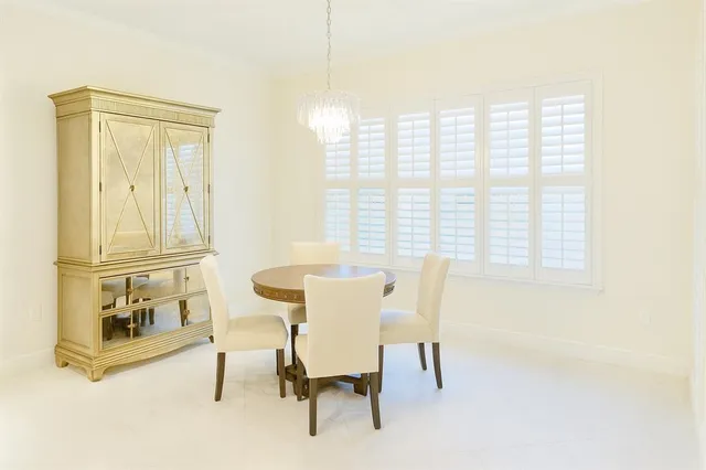a bath tub sitting in a bathroom next to a window